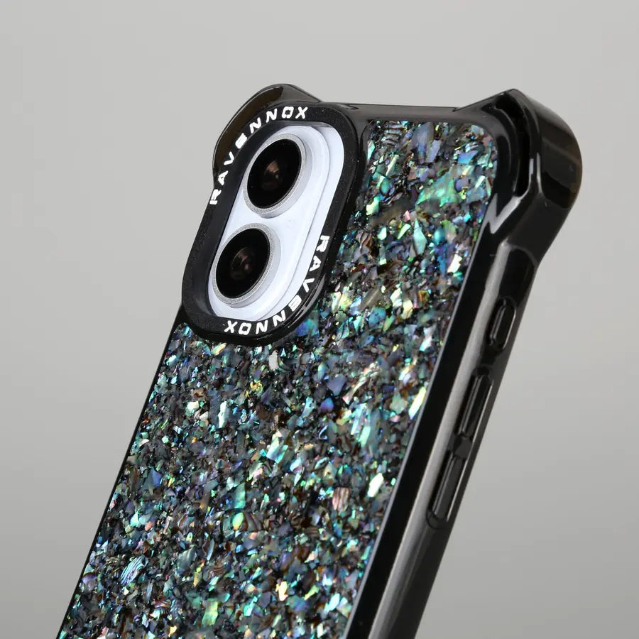 The sculpted Summit frame beside its iridescent Aurora Pearl finish